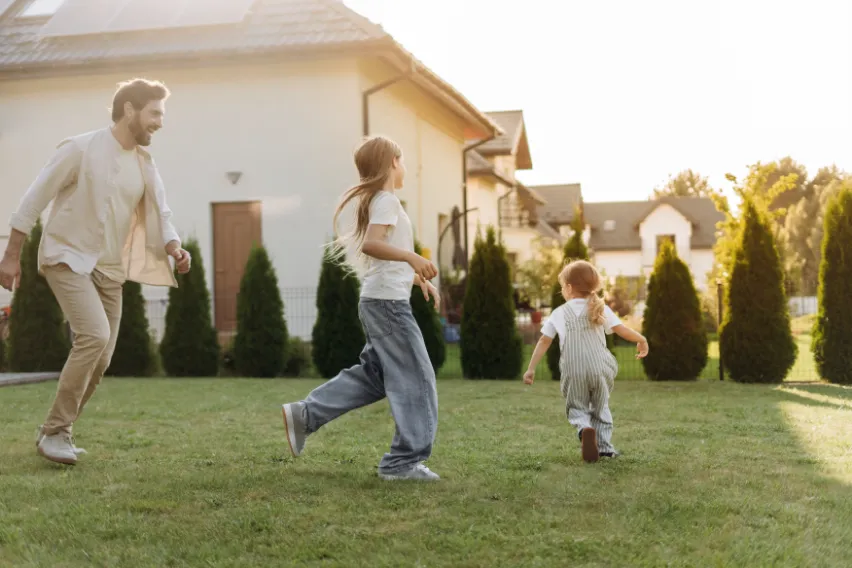 Family playing in yard