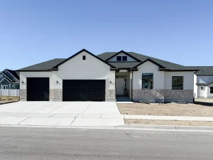 Beautiful light-colored residential home with dark gray and black accents